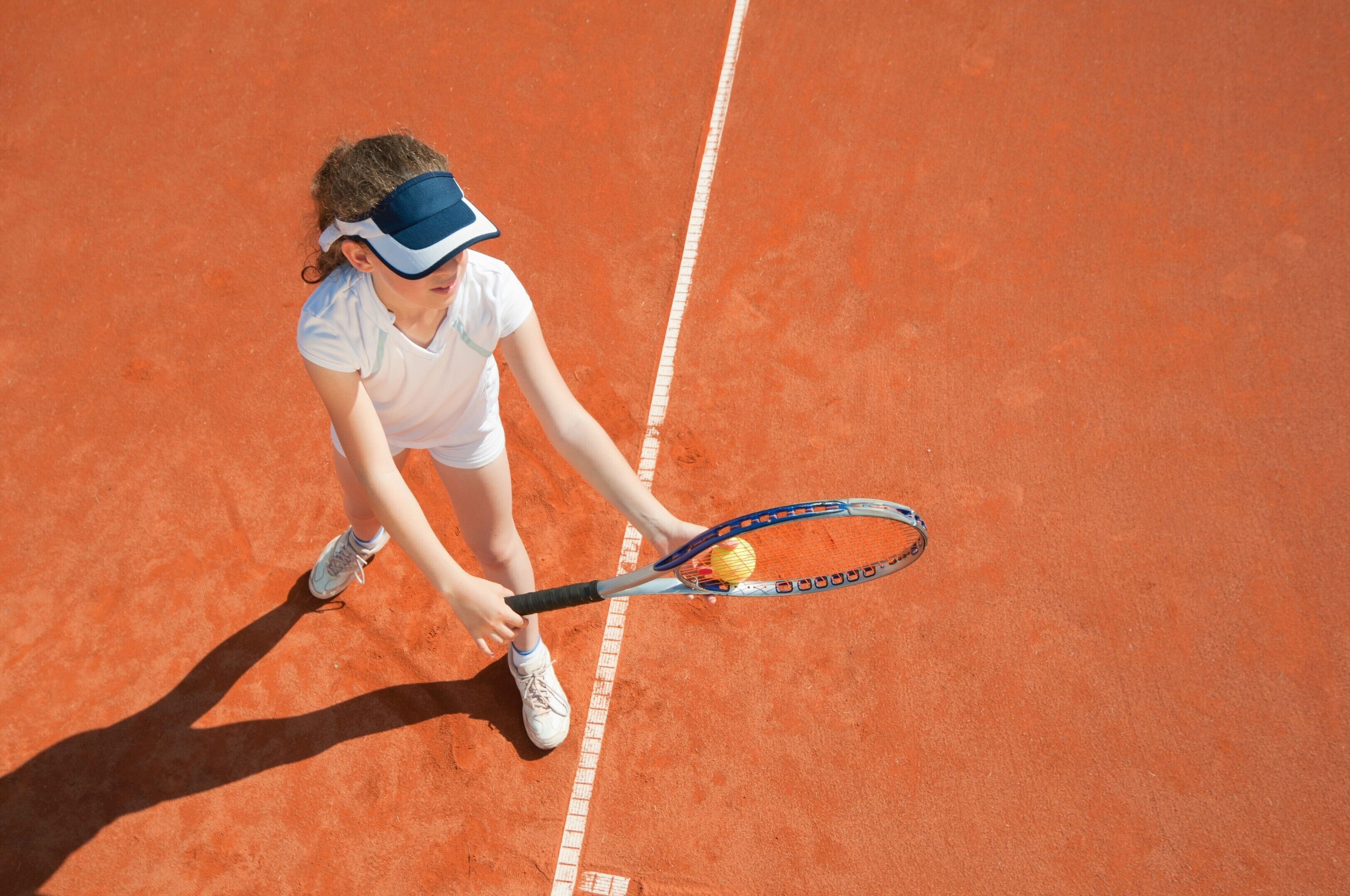 A tennis player on a clay court.