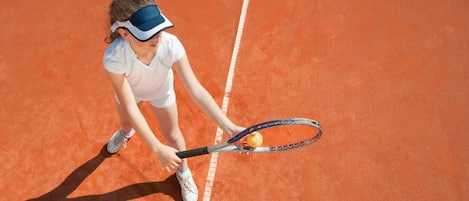 A tennis player on a clay court.