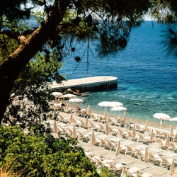 On the beach, sun-loungers, beach umbrellas, beach towels