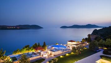 Relax by the pool or stroll through the beautifully landscaped garden with a turret in the historic building.