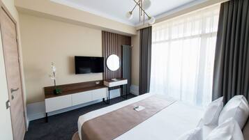 Double Room | Minibar, in-room safe, individually decorated, desk