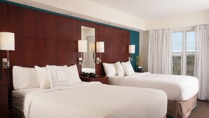 A hotel room with two beds, a large mirror, and a view of the outdoors. - Residence Inn by Marriott Fort Myers Sanibel (Fort Myers)