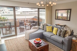 2 Bedroom Apartment | Living area | Flat-screen TV, DVD player, pay films - Sunshine Letting Apartments (Cape Town)