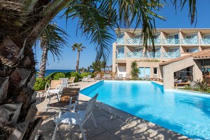 Outdoor pool, pool umbrellas, sun loungers