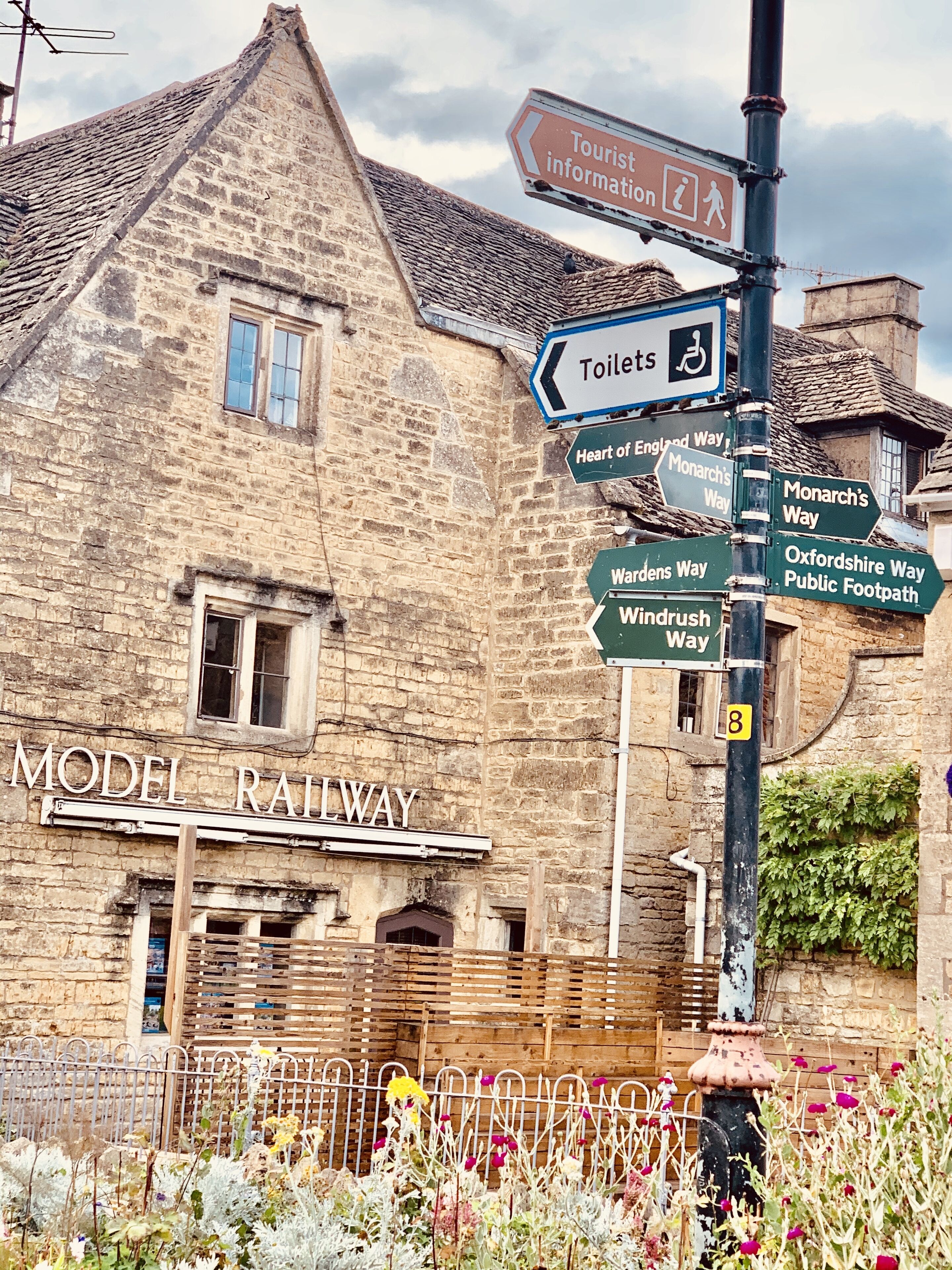 A stone building with a sign for Model Railway.