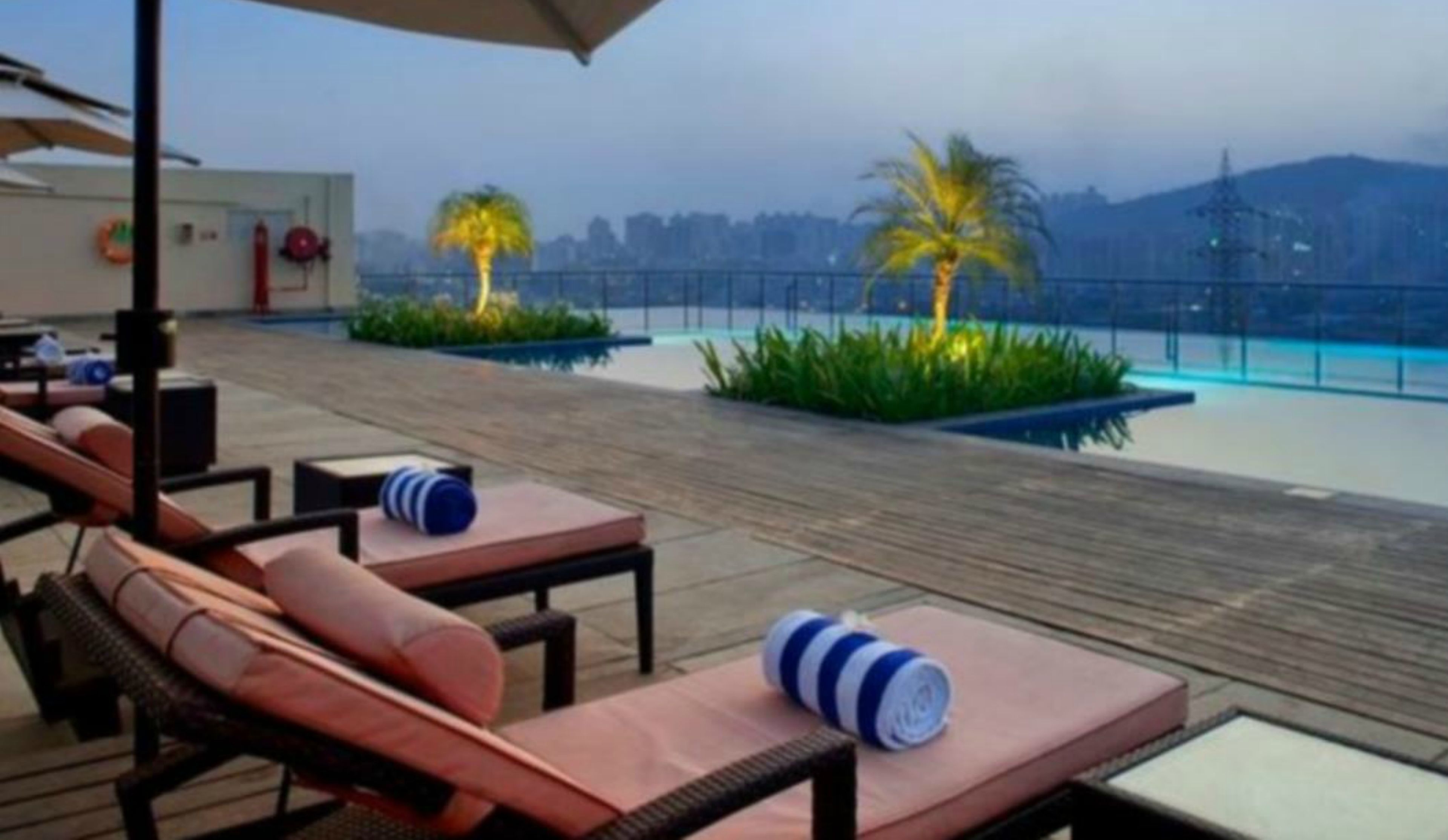 Outdoor pool, open 6 AM to 8 PM, pool umbrellas, sun loungers