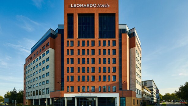 A modern hotel building with a prominent 'Leonardo Hotels' sign, featuring a brick facade and large windows. - Leonardo Hotel Swindon  (Swindon)