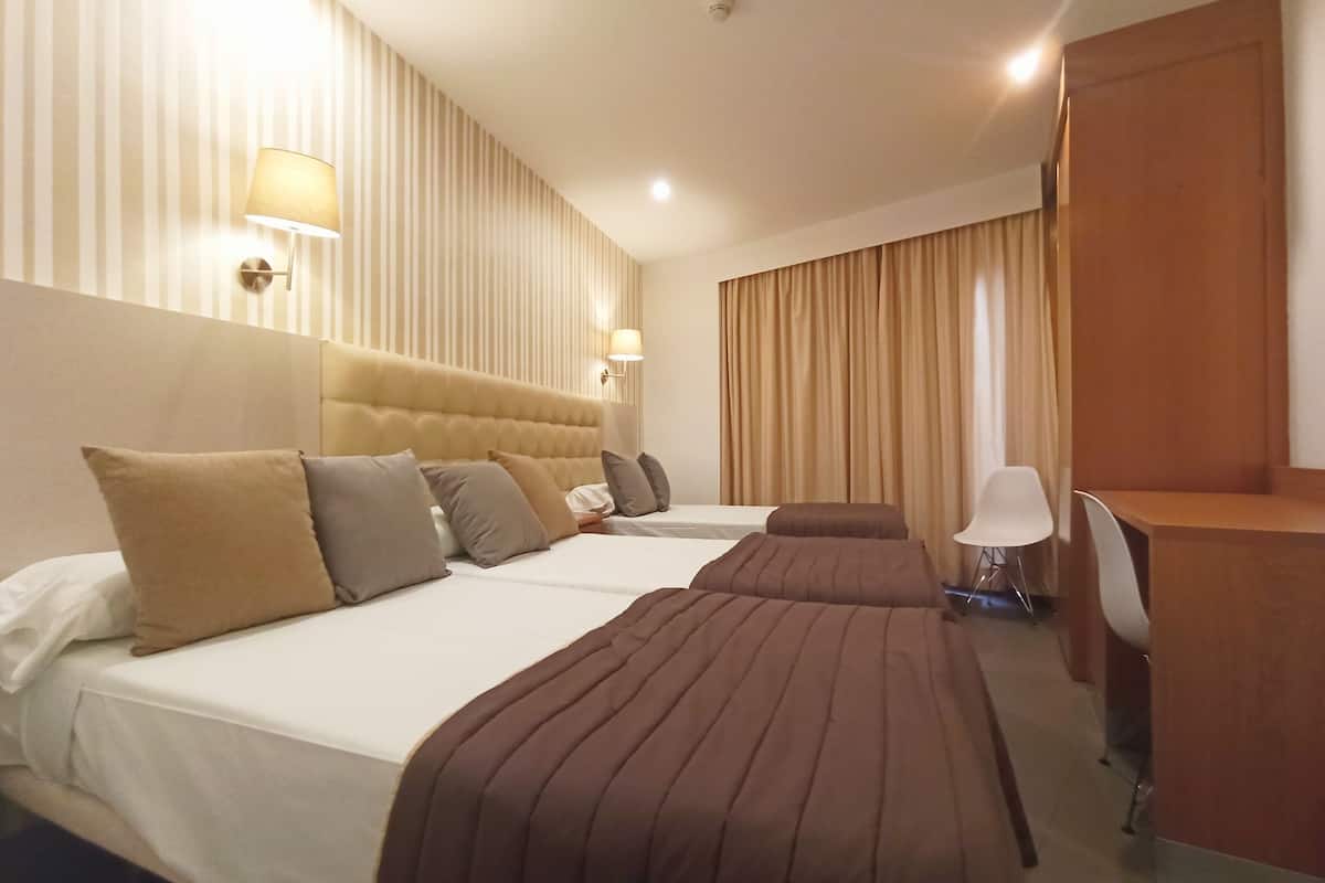 triple room | premium bedding, minibar, desk, blackout curtains