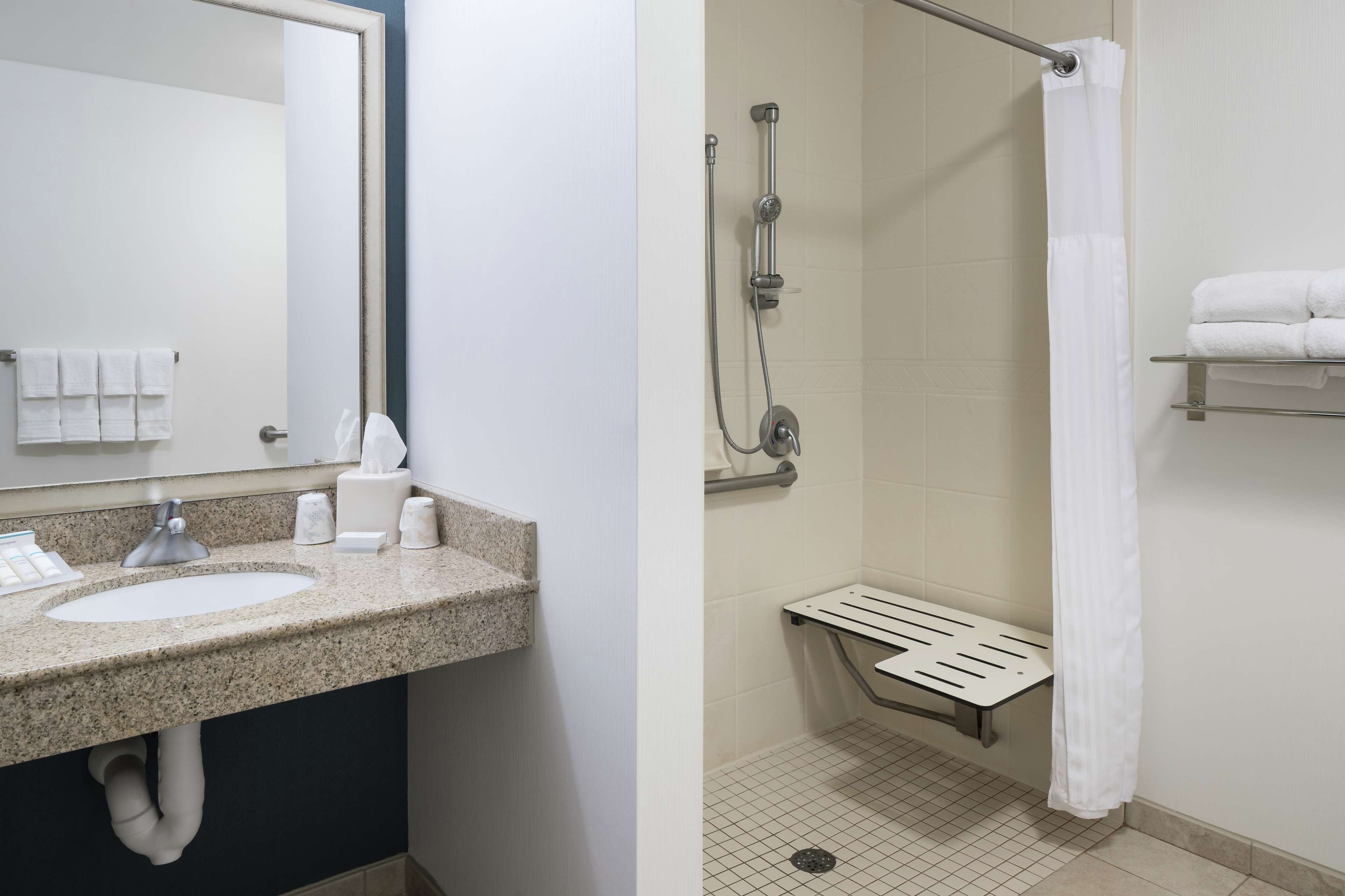 bathtub, free toiletries, hair dryer, towels