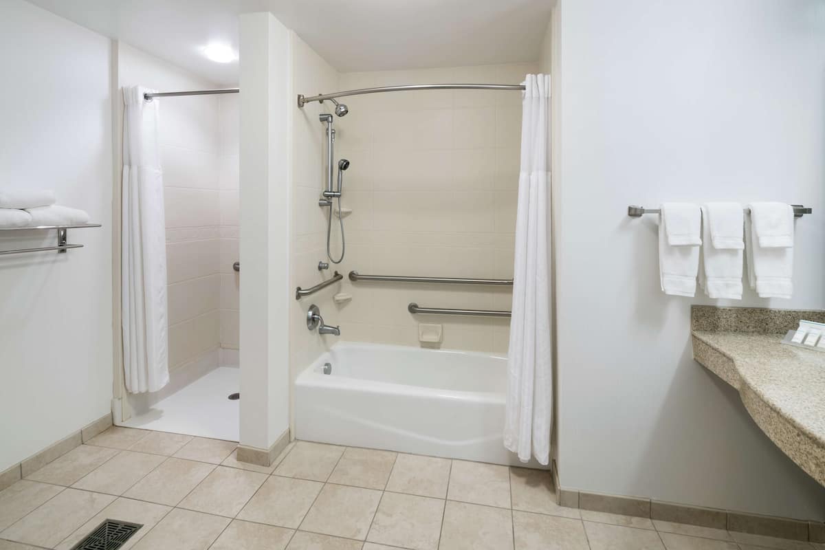 bathtub, free toiletries, hair dryer, towels