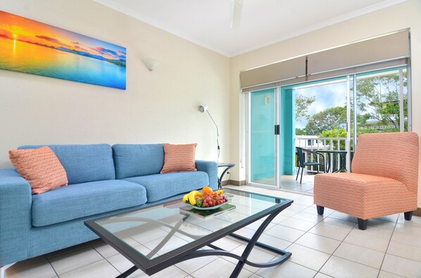 1 Bedroom Apartment (Adults Only) | Living area | LED TV, DVD player - Le Cher Du Monde (Port Douglas)