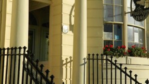 A building with a sign reading "The Prince Regent Hotel." - The Prince Regent Hotel (Brighton)