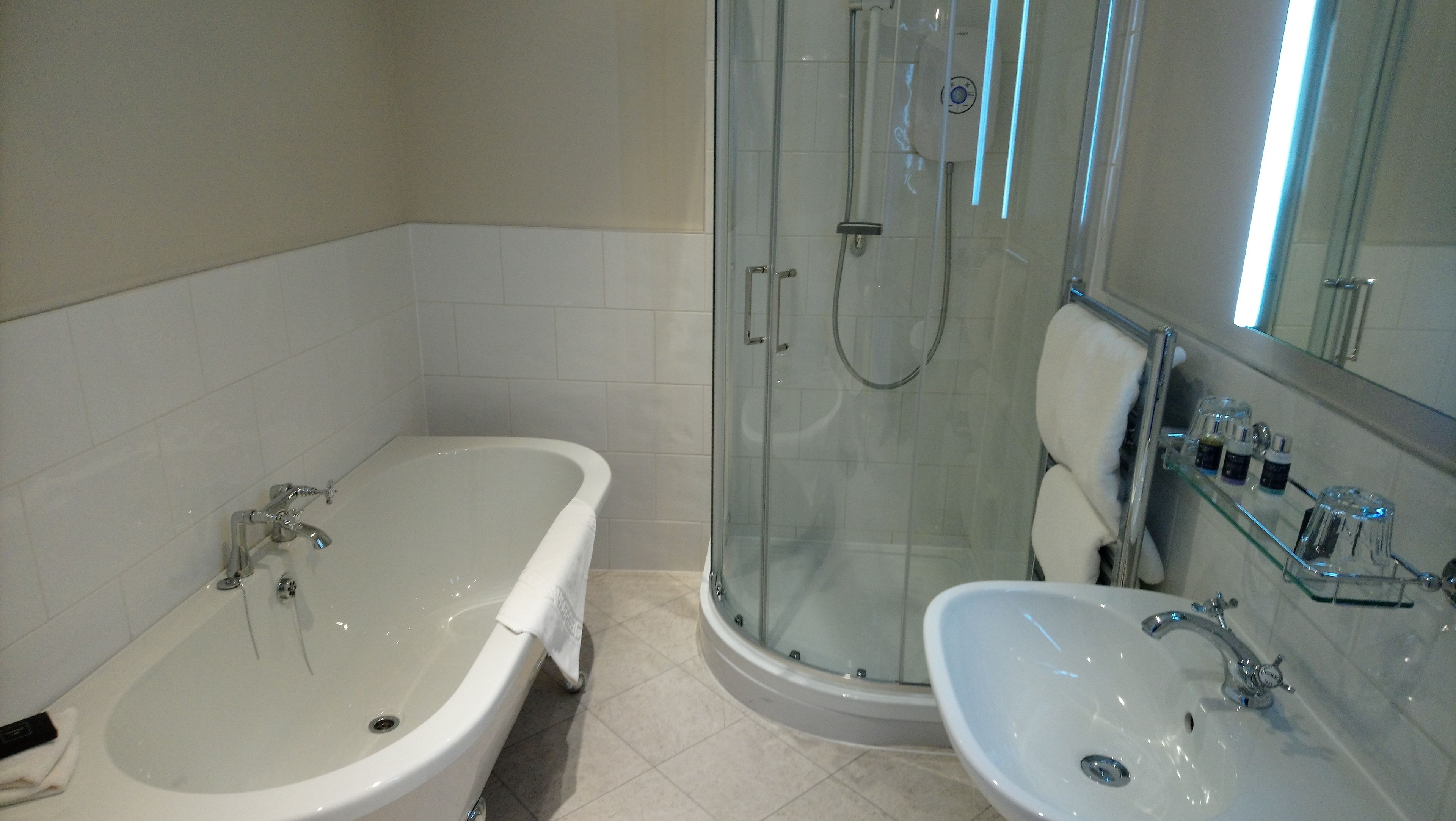 deluxe double room, 1 king bed | bathroom | free toiletries, hair dryer, towels