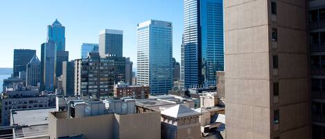 A cityscape with modern high-rise buildings and a mix of architectural styles.