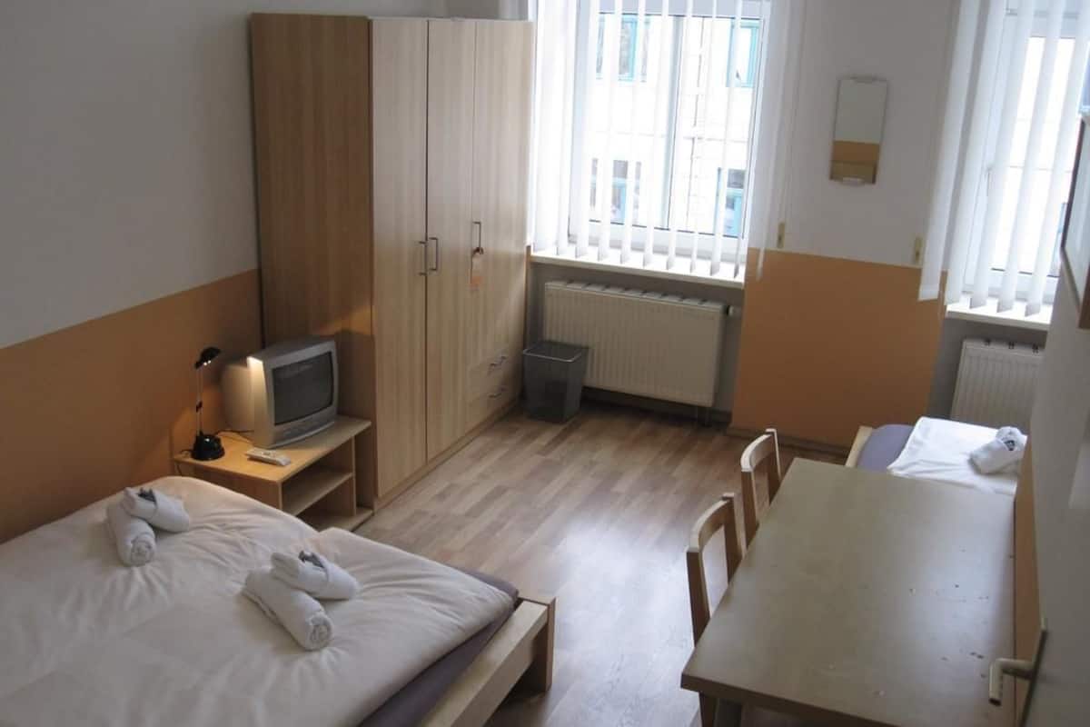 Family Room | Desk, iron/ironing board (on request), cribs (free)