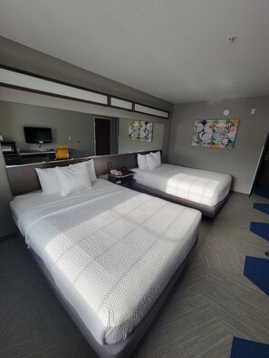 Standard Room, 2 Queen Beds | Desk, laptop workspace, blackout drapes, iron/ironing board - Microtel Inn & Suites by Wyndham Council Bluffs/Omaha (Council Bluffs)