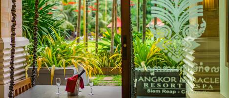 A view of a resort entrance with a sign for Angkor Magic Resort.