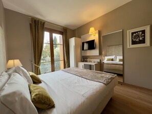 Camera Singola Spaziosa Economy | Literie de qualité, minibar, coffre-fort, bureau
