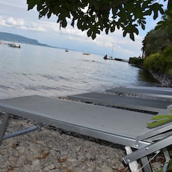 On the beach, sun-loungers, beach umbrellas, beach towels