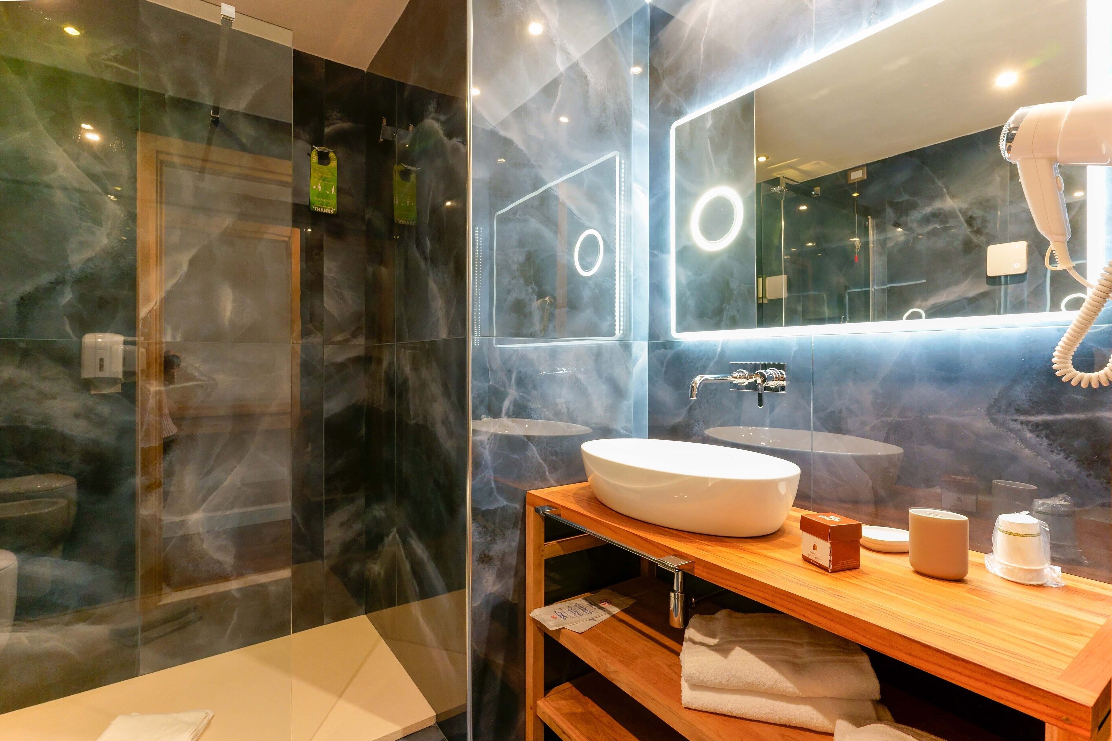 deluxe room with private spa | bathroom | shower, free toiletries, hair dryer, bidet