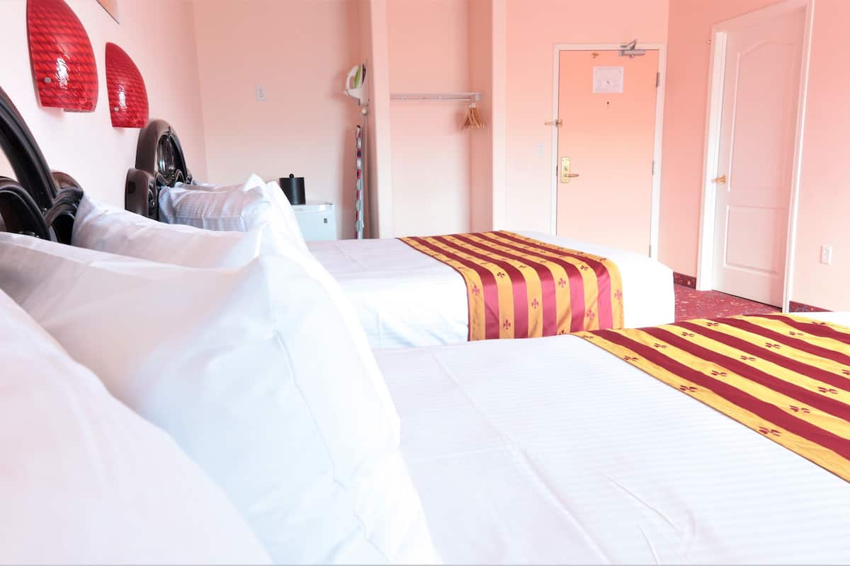 premium double room, 2 queen beds, fireplace | premium bedding, desk, blackout curtains, iron/ironing board