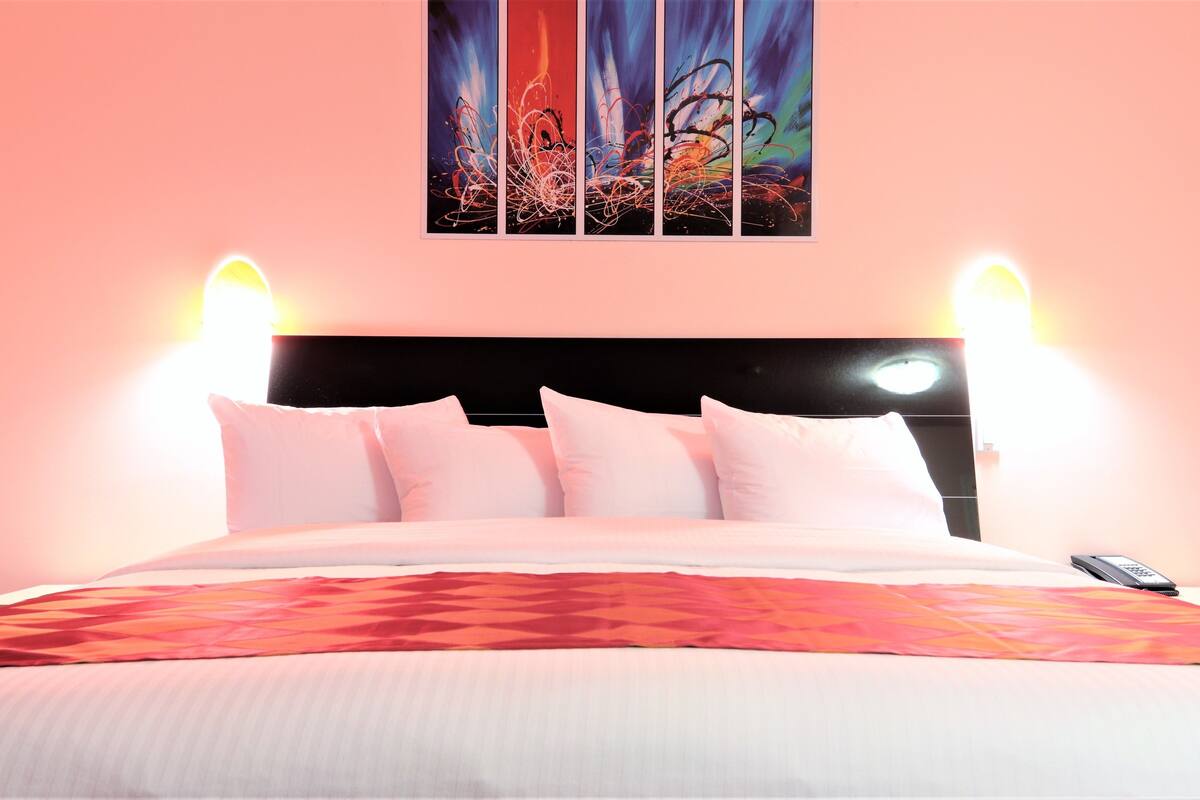 premium comfort room, 1 king bed | premium bedding, desk, blackout curtains, iron/ironing board