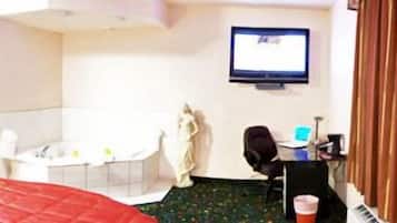 Standard Room, 1 King Bed, Jetted Tub | Living area | 50-inch plasma TV with cable channels, TV, fireplace