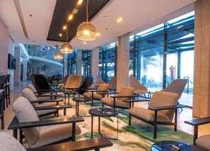 Relax in our inviting lobby with comfortable seating and stylish lighting.