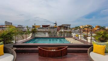 Indoor pool, outdoor pool, pool umbrellas, pool loungers