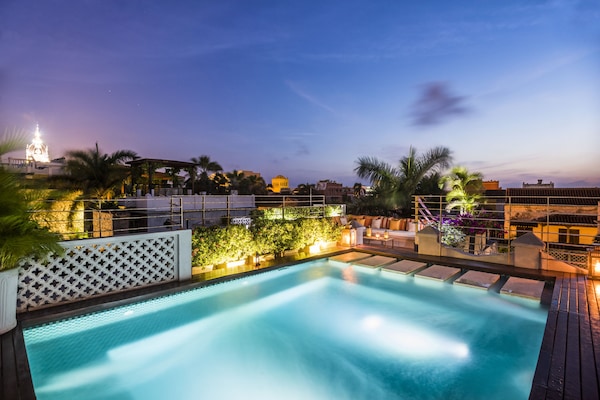 Indoor pool, outdoor pool, pool umbrellas, pool loungers