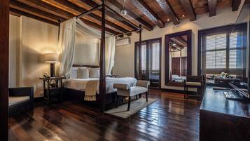 Junior Suite | Minibar, in-room safe, individually furnished, iron/ironing board