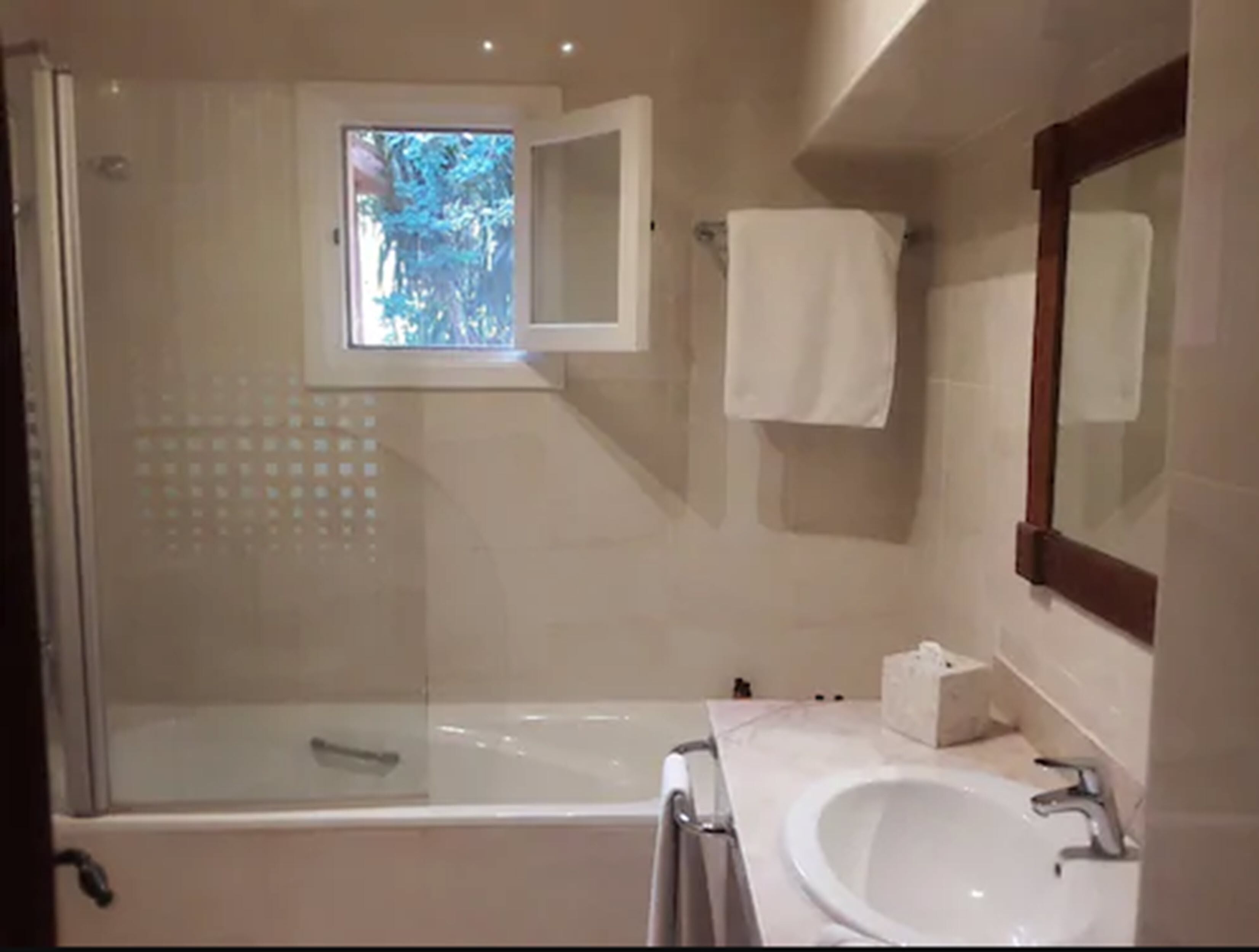 combined shower/bathtub, free toiletries, hair dryer, bathrobes