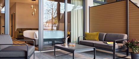 Junior Suite Garden | In-room safe, desk, laptop workspace, blackout drapes