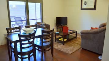 One-Bedroom Deluxe Apartment - Pet Friendly on Request | Living area | LCD TV, DVD player