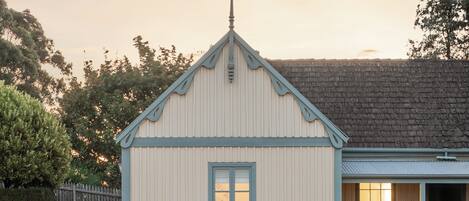 A single-story building with a gabled roof and a small porch.