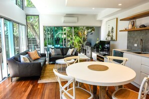 Beach House Two Bedroom | Living area | 60-inch LCD TV with cable channels - East on Byron (Byron Bay)