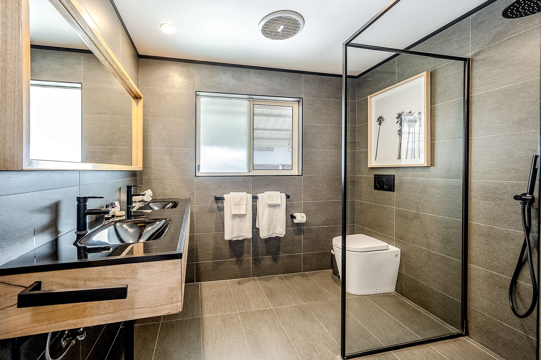 deluxe apartment | bathroom | shower, hair dryer, towels