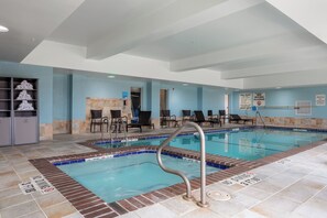 A swimming pool with a no diving sign, lounge chairs, and a reception area. - Holiday Inn Express & Suites El Paso West by IHG (El Paso)