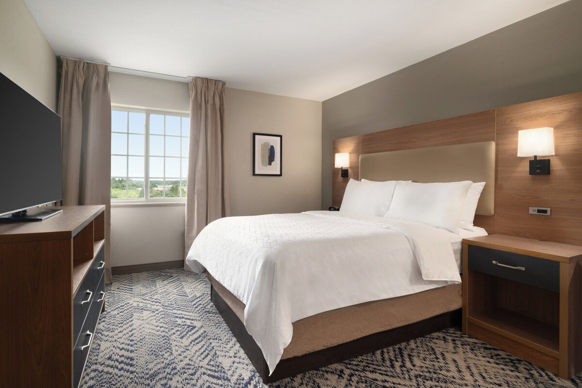Premium bedding, desk, laptop workspace, blackout curtains