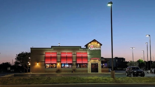 A building with a sign reading "Applebee's" and a brick facade.