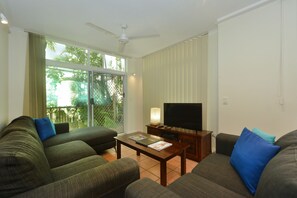Three Bedroom Two Bathroom Apartment | Living area | Flat-screen TV - Seascape Holidays - Tropic Sands (Port Douglas)