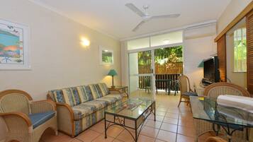 Basic Apartment, 1 Bedroom | Living area | Flat-screen TV