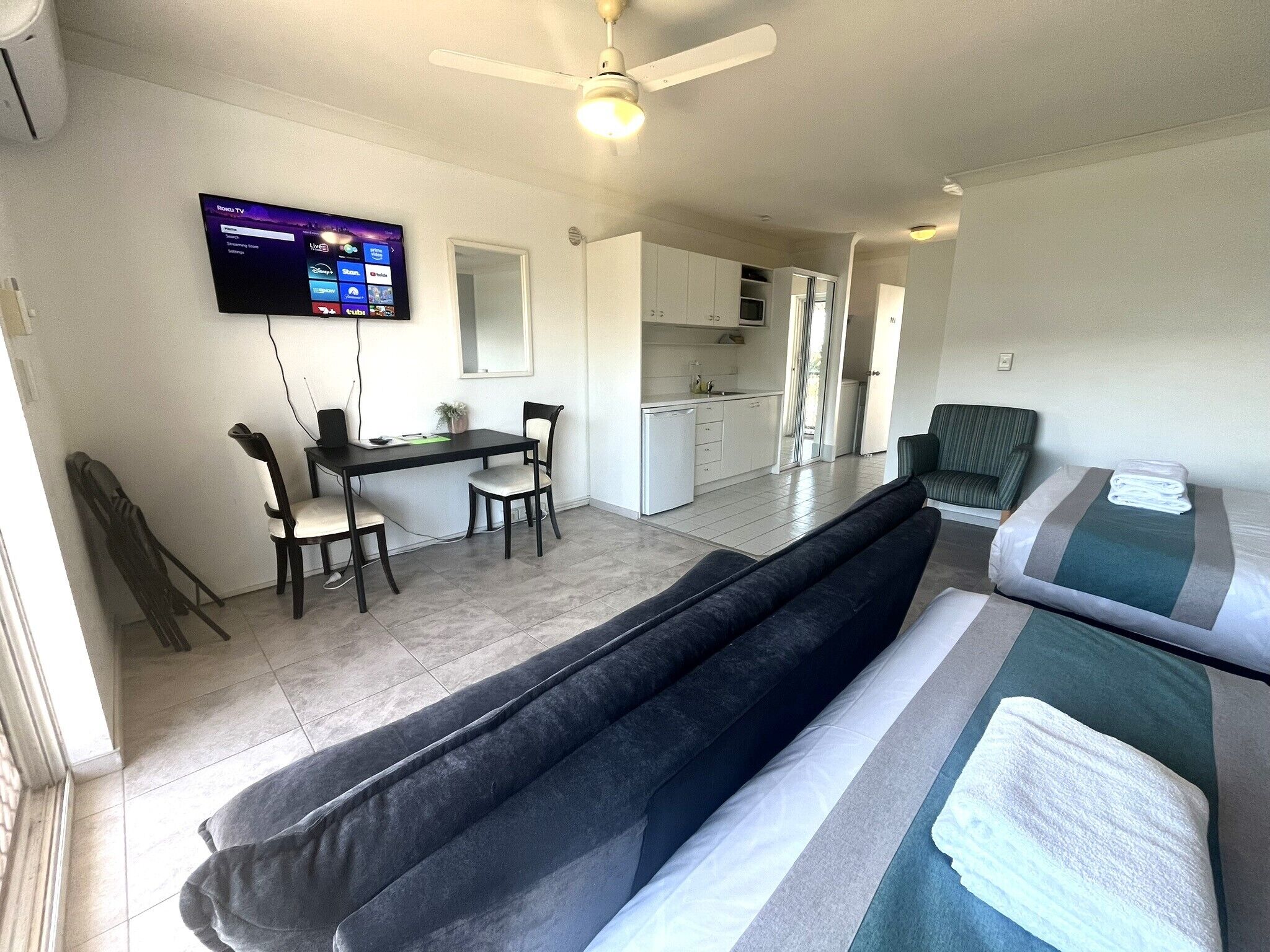 Superior Room, Multiple Beds | Living area | Flat-screen TV