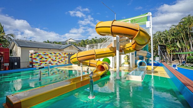A water park with multiple slides and a pool area. - Turtle Beach Resort (Mermaid Beach)