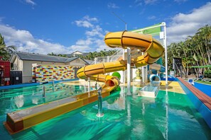A water park with multiple slides and a pool area. - Turtle Beach Resort (Mermaid Beach)