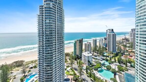 A high-rise hotel with a pool and beach view. - Aegean Apartments (Surfers Paradise)