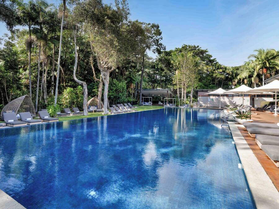 Outdoor pool, open 6 AM to 9 PM, pool umbrellas, pool loungers