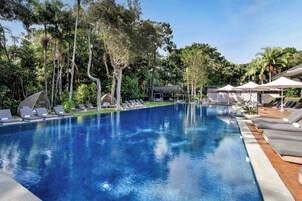 Outdoor pool, open 6 AM to 9 PM, pool umbrellas, pool loungers