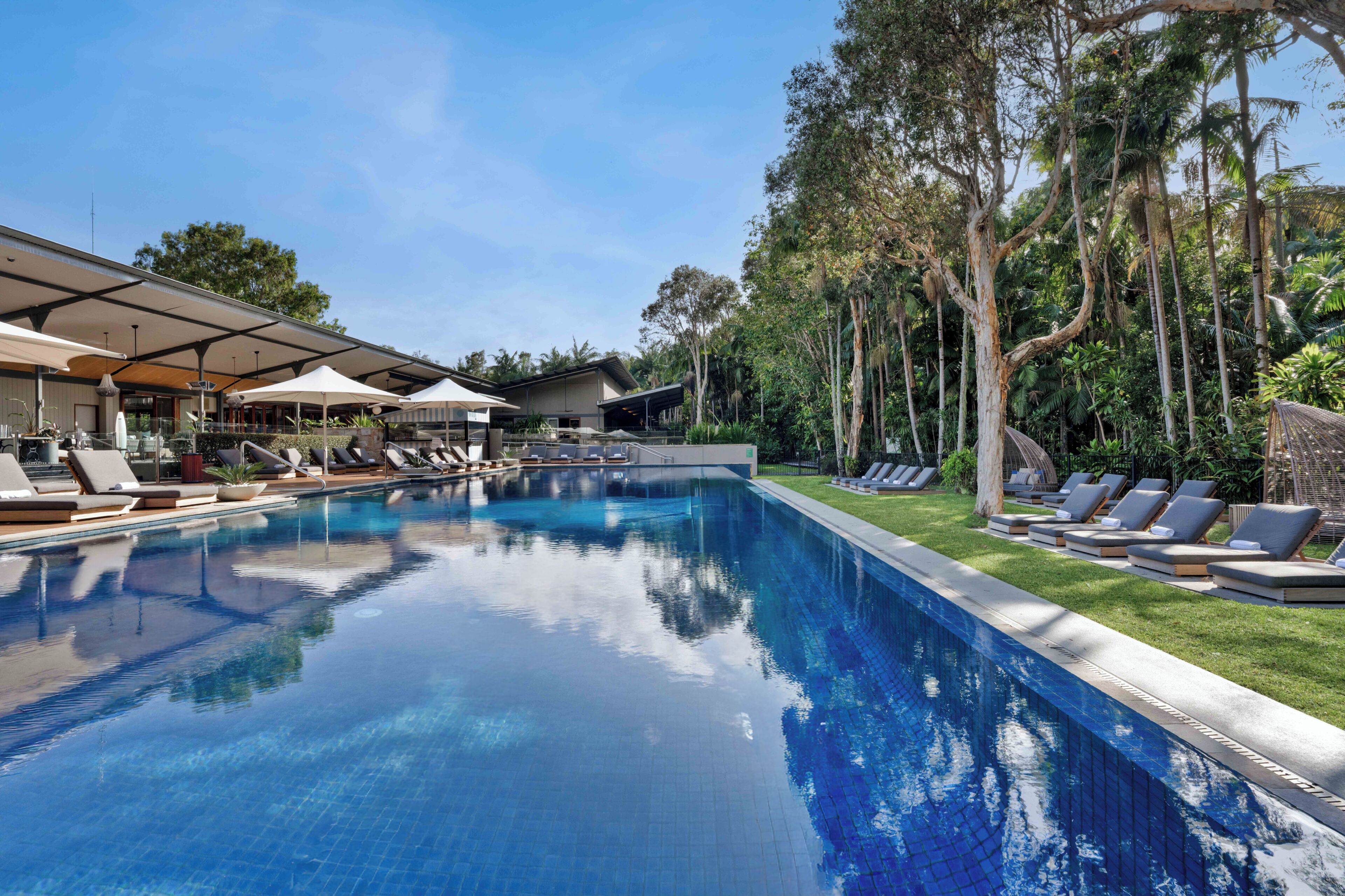Outdoor pool, open 6 AM to 9 PM, pool umbrellas, pool loungers