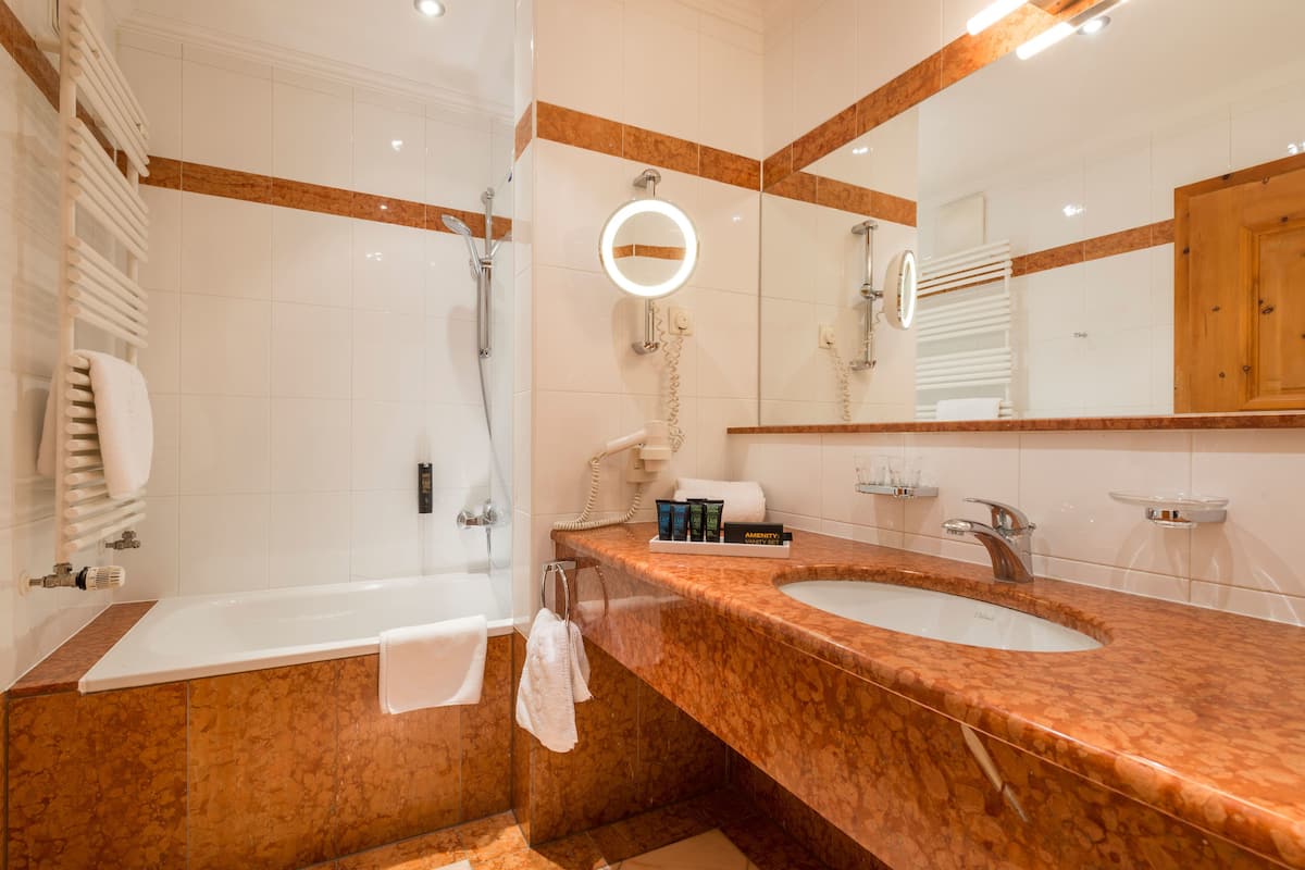 junior suite, balcony (valentina) | bathroom | free toiletries, hair dryer, bathrobes, slippers